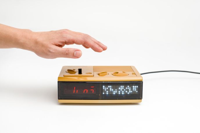 Justin and Sheree's fused radio clock made interactive by Clement Zheng